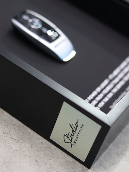 Side angle view of AMG key frame showing professional craftsmanship and depth
